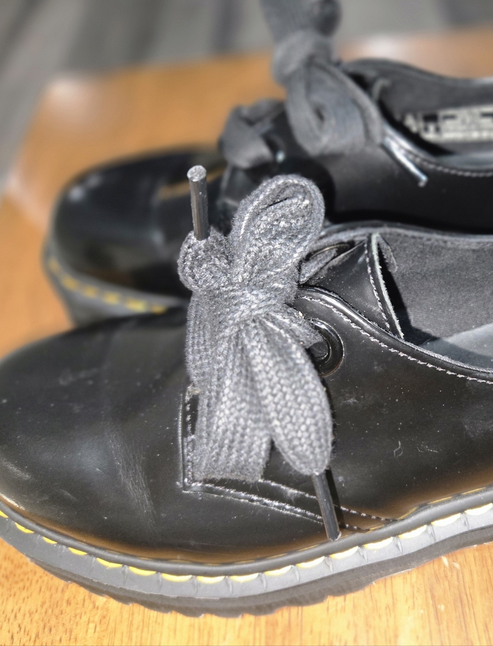 Dr. Martens Black Leather Lace-Up Boots with Yellow Welt Stitching